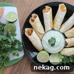 Baked Honey Lime Chicken Taquitos with creamy cilantro sauce.
