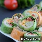 Tortilla Pinwheels with meat, cheese, and creamy filling.