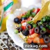 Seven Layer Dip, a tasty dip everyone loves, perfect for parties and gatherings.