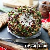 This Cranberry Pecan Cheese Ball is a festive appetizer for Thanksgiving, Christmas, or New Year's Eve! So easy to make, and tastes great!