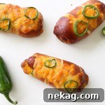 Jalapeno Popper Pretzel Dogs: hot dog wrapped in soft pretzel dough, stuffed with cheese and jalapenos.