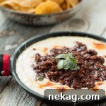 Mexican Queso Fundido chorizo dip, cheesy, spicy and perfect with tortilla chips.