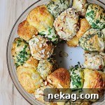 Savory monkey bread is quick and easy, thanks to refrigerated biscuits that are dipped in garlic butter and coated in herbs and cheese.