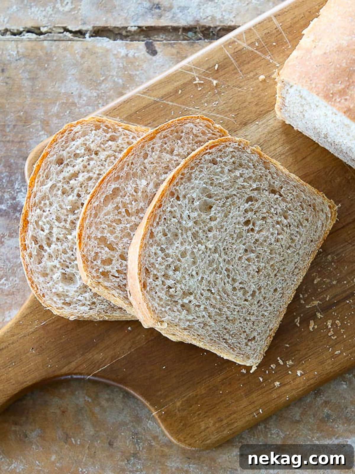 Hearty Whole Wheat Sandwich Loaf 2 A beautifully baked, soft sandwich loaf with even slices revealing a tender crumb and golden brown crust, ready for enjoyment.
