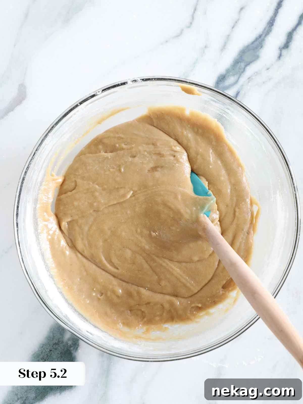 A close-up of mixed blondie batter in a bowl, showcasing its thick and glossy texture before baking.