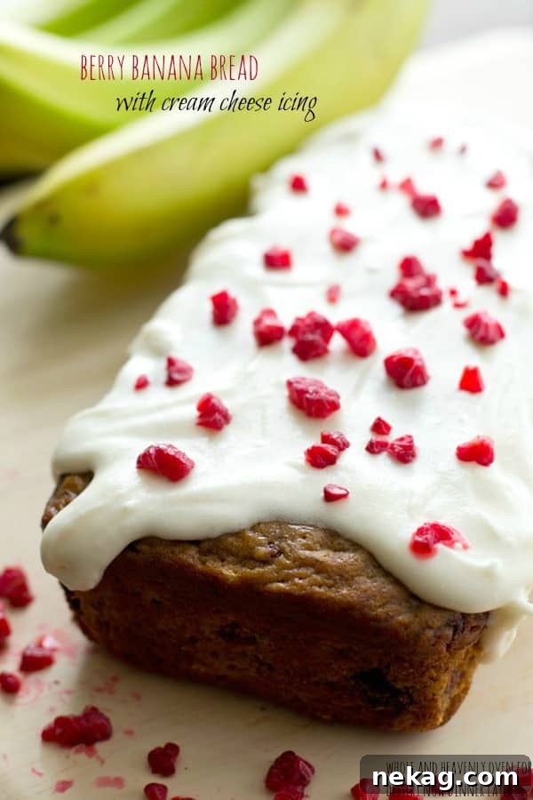 Super-soft and moist Berry Banana Bread with juicy berries and tangy cream cheese icing
