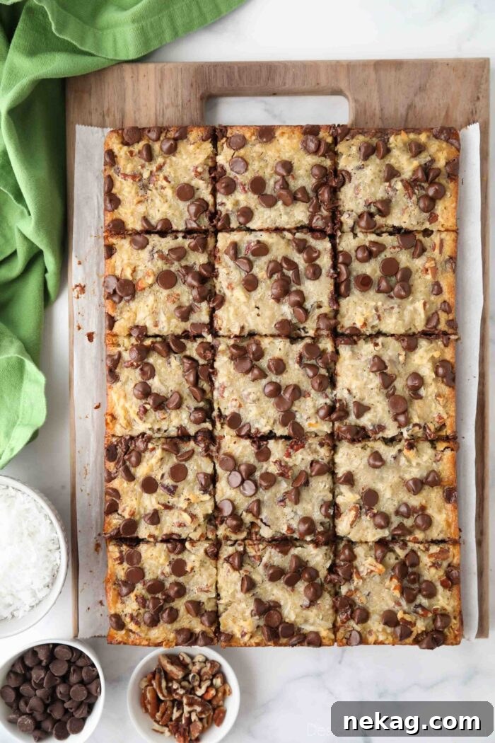 Decadent German Chocolate Bars 3 Top view of delicious German Chocolate Bars cut into neat squares on a rustic wooden cutting board, ready to be served.