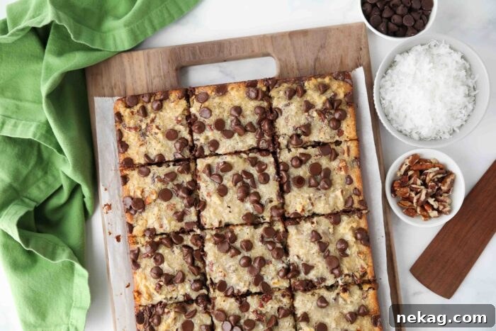 Decadent German Chocolate Bars 10 Overhead shot of freshly baked German Chocolate Bars, perfectly cut into squares and arranged on a wooden cutting board.