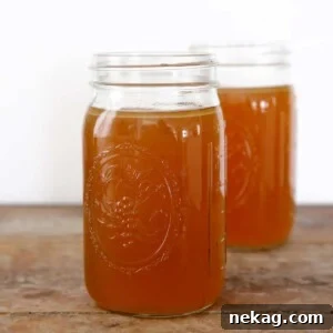 Homemade chicken broth in mason jars.