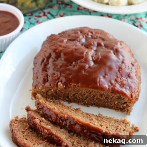 Delicious Slow Cooker Meatloaf with a savory-sweet brown sugar and balsamic glaze, cooked to perfection.