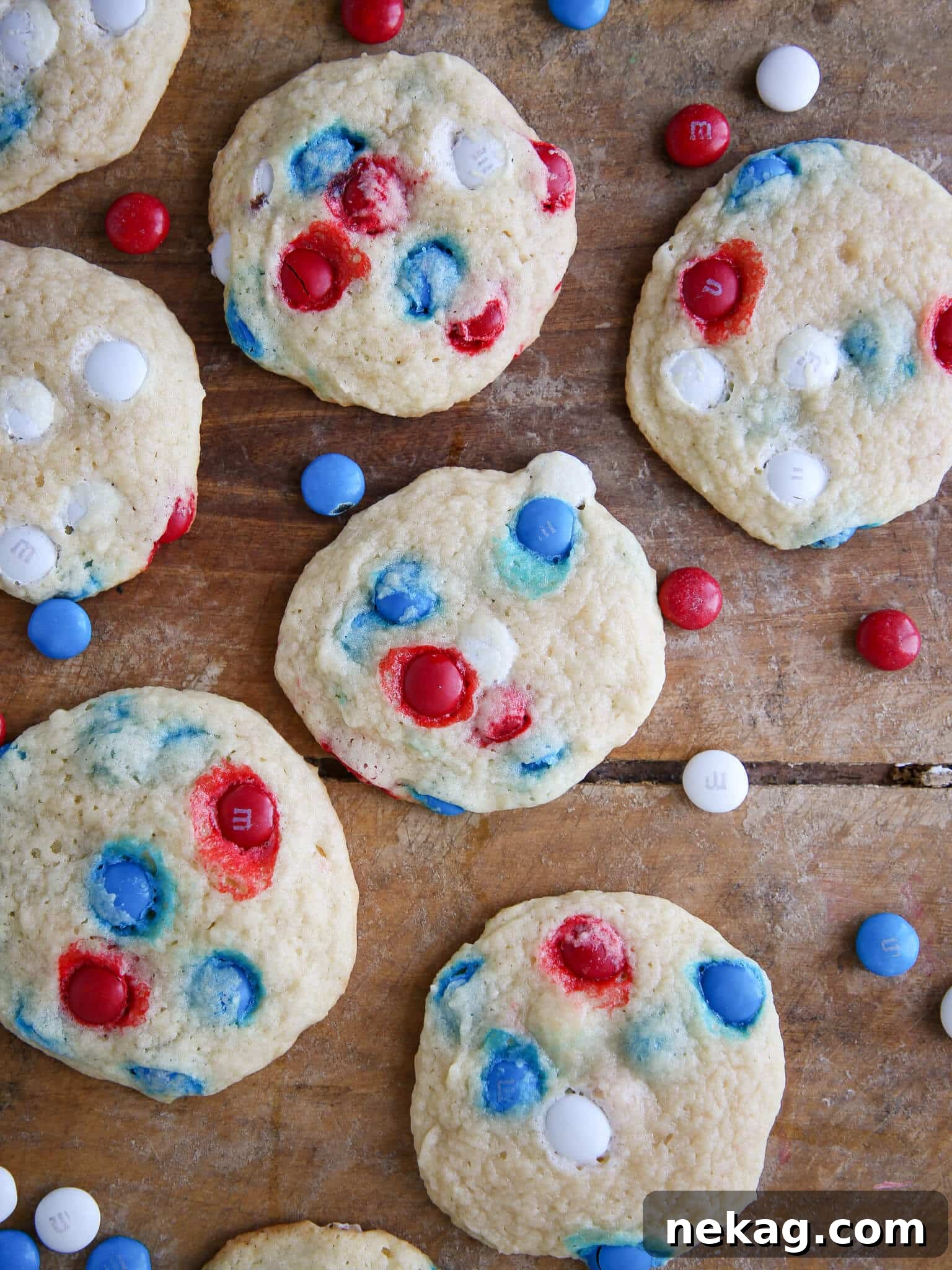 Patriotic M&M Sugar Cookies on wooden surface red white blue