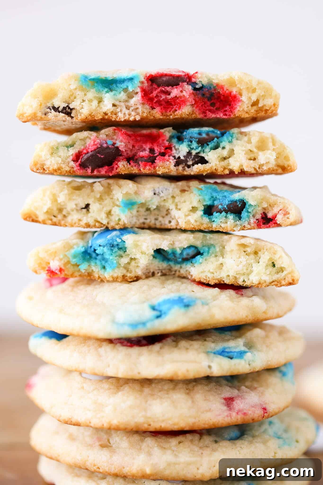 Patriotic M&M Sugar Cookies broken open tall stack