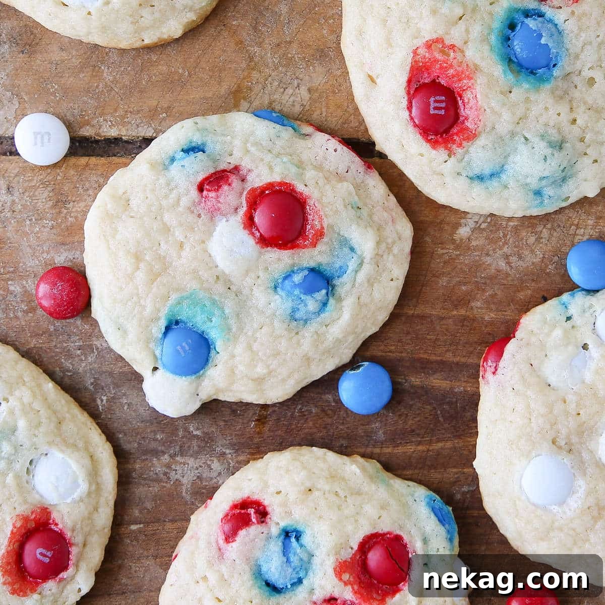 Patriotic M&M Sugar Cookies on wooden surface