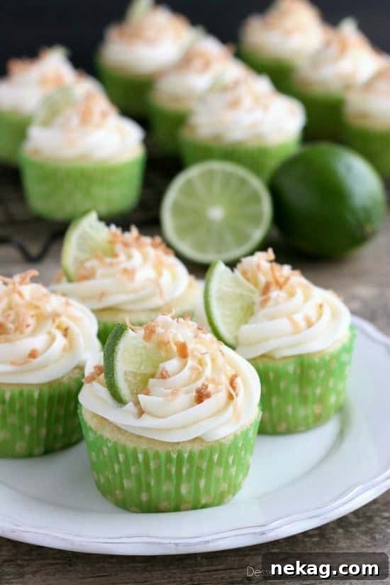 A trio of freshly baked Coconut Lime Cupcakes, ready for serving.