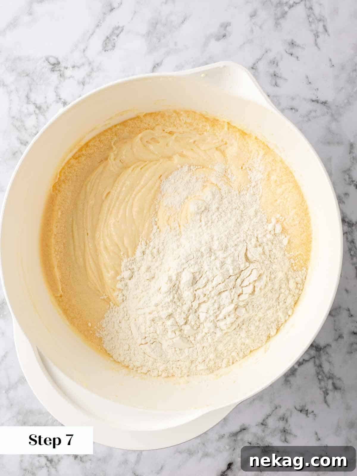 Zesty Lemon Loaf 7 Mixing dry ingredients into the lemon pound cake batter.