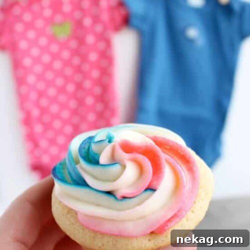 Delicious Gender Reveal Cupcakes with swirled frosting and a hidden colored heart, perfect for a baby shower.