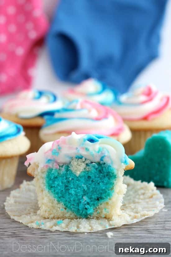 He or She Sweet Bites 5 Baked blue cake batter cut into heart shapes with a cookie cutter for gender reveal cupcakes.