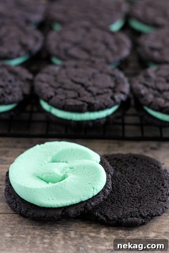 Two Homemade Mint Oreos showing the dark chocolate cookie and green mint filling