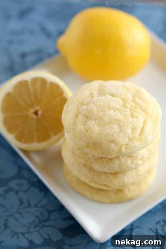 Close-up of a perfectly soft and chewy lemon cookie, showcasing its delightful texture.