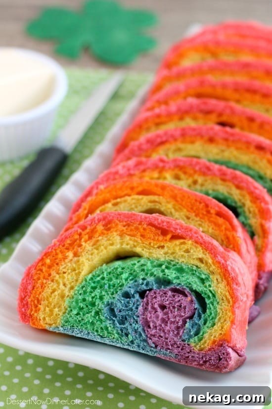 Vibrant Rainbow Bread made with Rhodes frozen dough, featuring six bright colors swirled into a fun loaf, perfect for a festive meal or St. Patrick's Day French toast.
