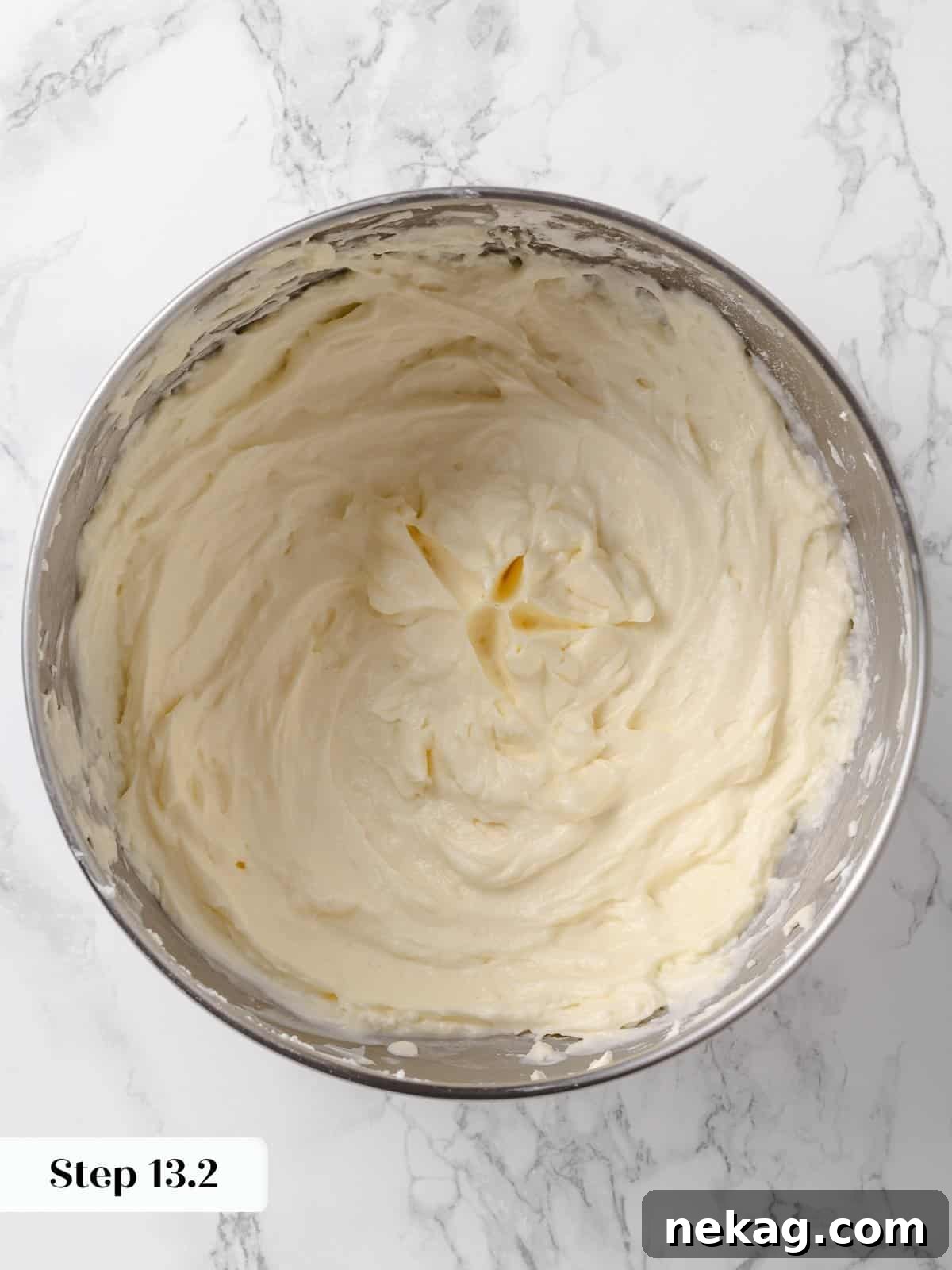 Bowl of smooth, fluffy cream cheese buttercream, perfectly mixed.