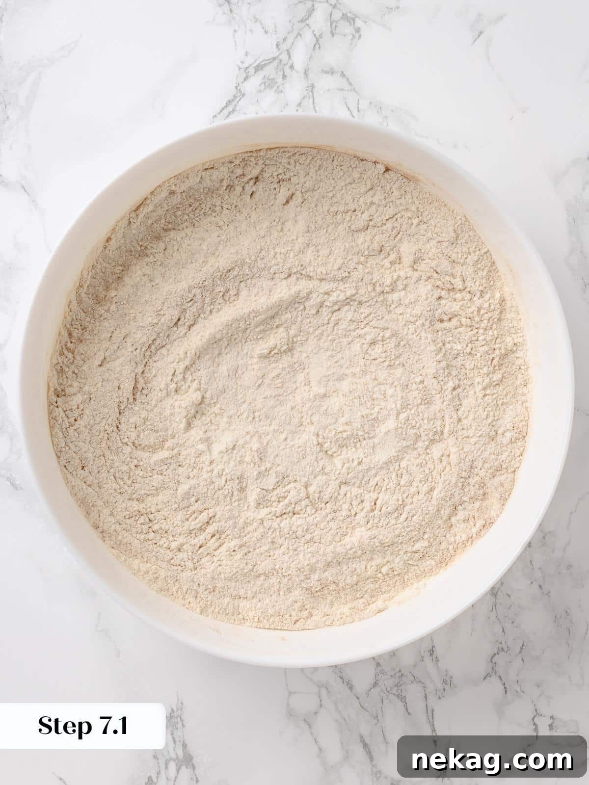 Bowl of flour, baking soda, baking powder, and spices mixed together.