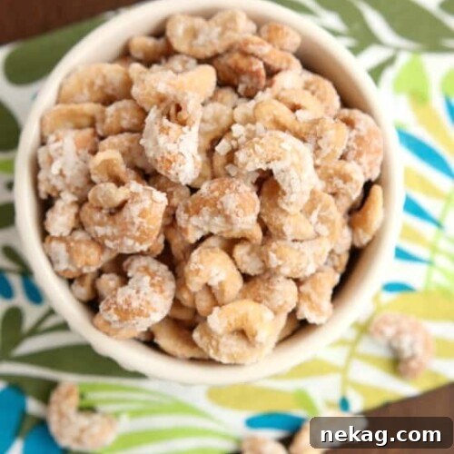 These Coconut Cashews, inspired by Trader Joe's, are made with coconut milk, coconut oil, sugar, and coconut flakes to create some incredibly delicious candied nuts!