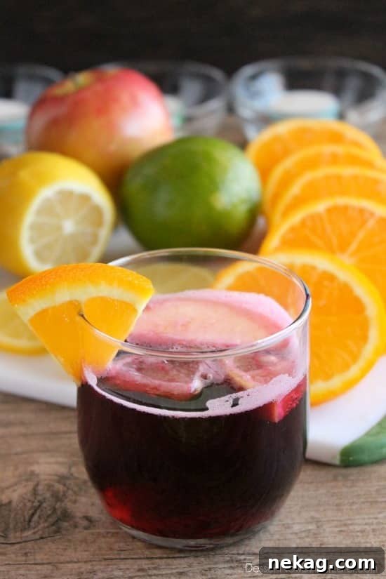 Easy Virgin Sangria - only 2 ingredients plus fresh cut fruit. A bubbly, fruity drink perfect for any party!