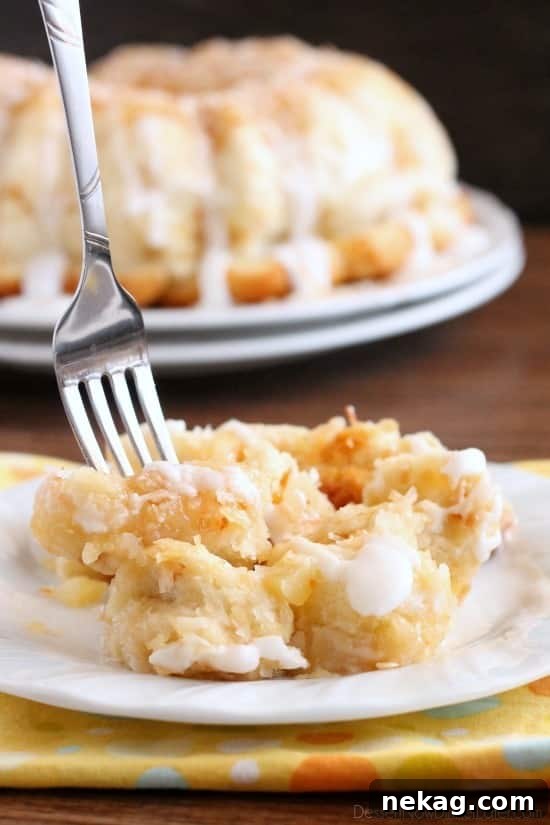 Pineapple Coconut Paradise Bread 3 Pina Colada Monkey Bread - toasted coconut, crushed pineapple, and a secret ingredient combine together to make this sticky pull apart bread a tropical treat!