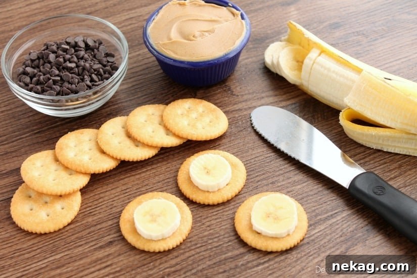 First step: placing a slice of banana on a RITZ® cracker for the Chocolate Peanut Butter Banana RITZ® Bites.