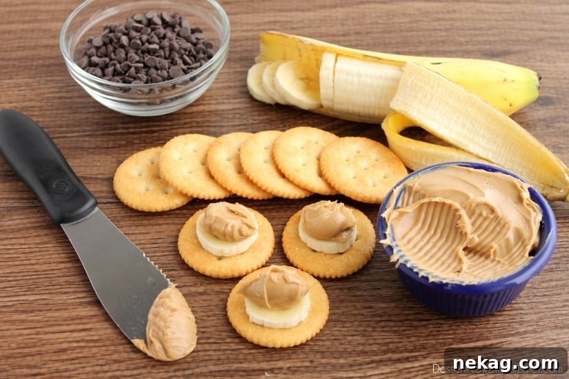 Second step: adding a dollop of peanut butter on top of the banana slice on the RITZ® cracker.