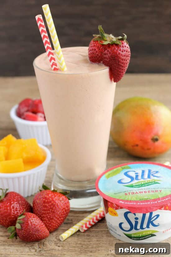 Creamy Dairy-Free Strawberry Mango Delight 5 A glass of Strawberry Mango Dairy-Free Smoothie, enjoyed as a healthy and refreshing drink.