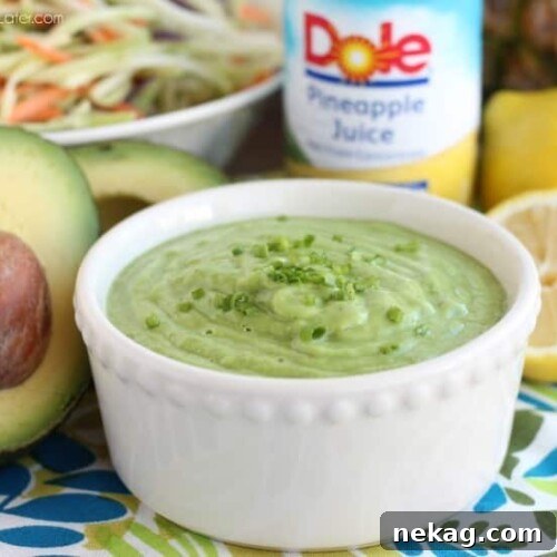 Vibrant Pineapple Avocado Dressing with fresh herbs, a healthy and creamy choice for salads.