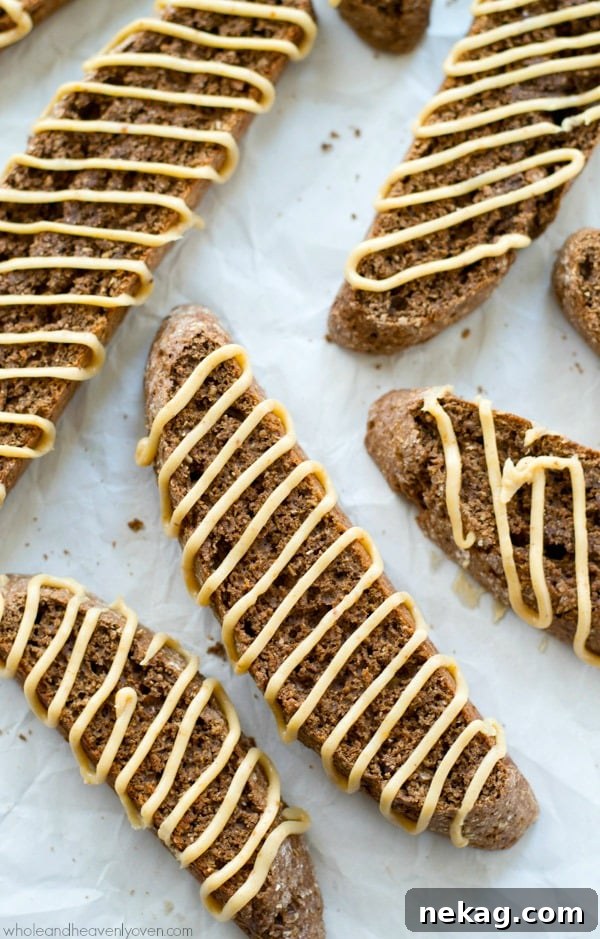 Close-up of a stack of Chocolate Biscotti with rich peanut butter drizzle.