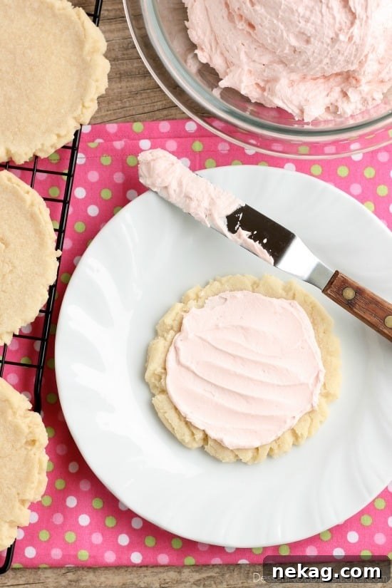 A stack of perfectly baked sugar cookies, showing their soft texture and rustic edges.