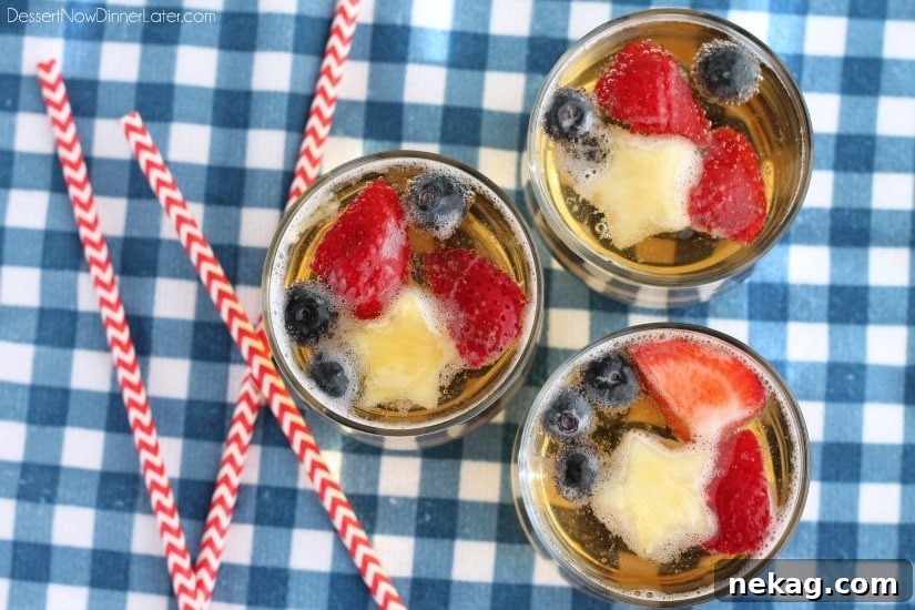 Patriotic Spark 3 Close-up of the Patriotic Punch, showing the delightful fizz and colorful fruit garnishes, including pineapple stars