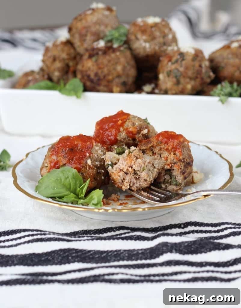Nonna's Italian Meatballs 5 Chef's hands skillfully forming round Italian Meatballs from the seasoned meat mixture