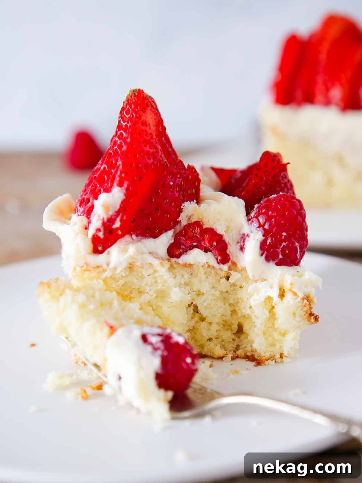 Vanilla cake American Flag Cake with vibrant berries, showcasing a delicious and patriotic dessert.