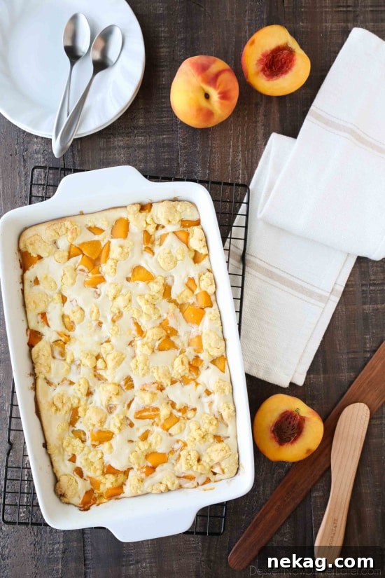 Fresh, ripe peaches ready for baking in a delicious Peaches and Cream Cobbler, a unique dessert blend of peach cobbler and cheesecake.