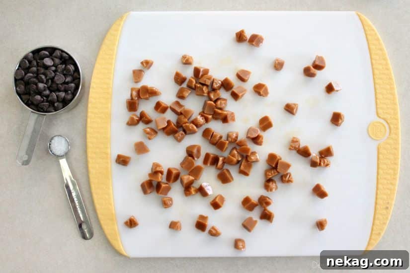 Decadent Chocolate Caramel Apple Crumble Squares 13 Caramels, chocolate chips, and sea salt measured out for toppings.