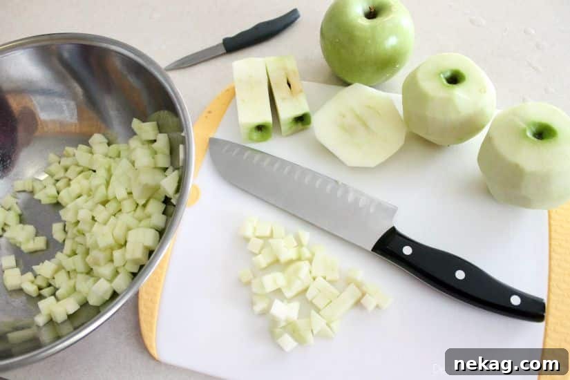 Decadent Chocolate Caramel Apple Crumble Squares 5 Diced Granny Smith apples ready for the apple crumb bars filling.