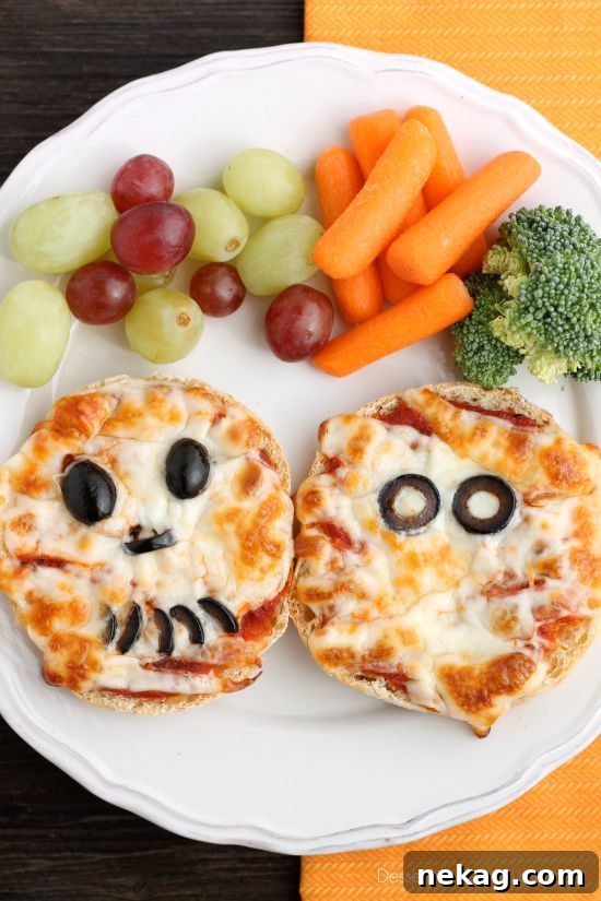 Spooky Swaddle Pizzettes 9 A single Mini Mummy Pizza showcasing its fun design, ready to be enjoyed.