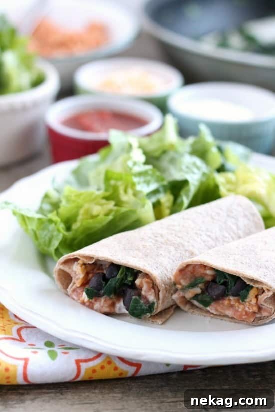 Hearty Spinach Bean Burrito 2 A perfectly wrapped Spinach & Bean Burrito, showcasing a delicious, healthy, and easy meatless meal option.