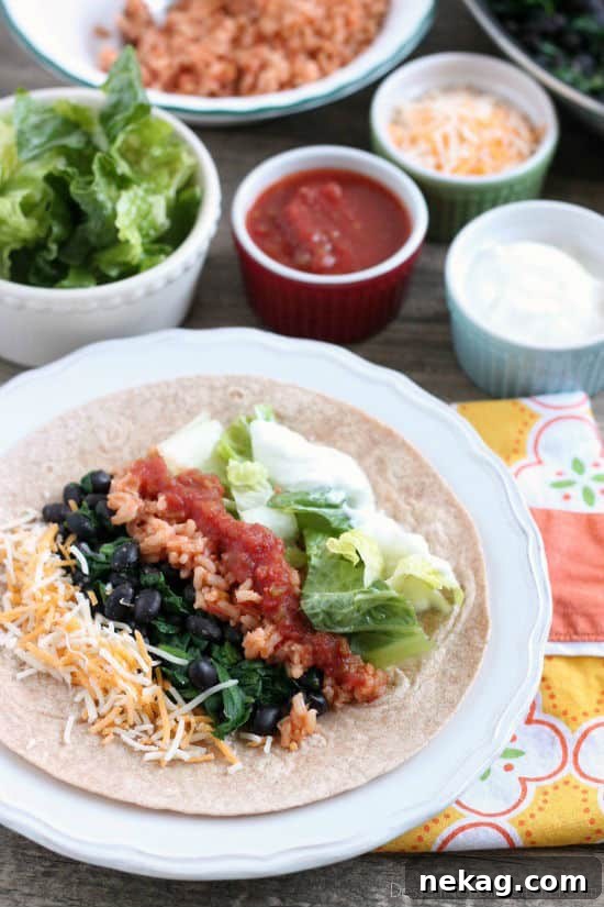 Hearty Spinach Bean Burrito 4 A freshly prepared Spinach & Bean Burrito Wrap, ready to be enjoyed as a healthy and filling meal.