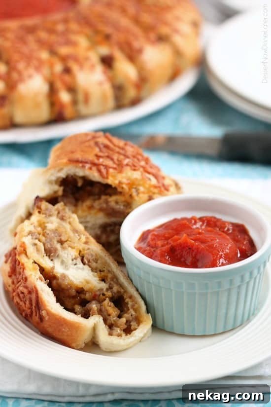 Hearty Sausage Stromboli 2 Delicious Sausage Stromboli, a hot sandwich perfect for crowds, dinner, or game day appetizers served with marinara sauce.
