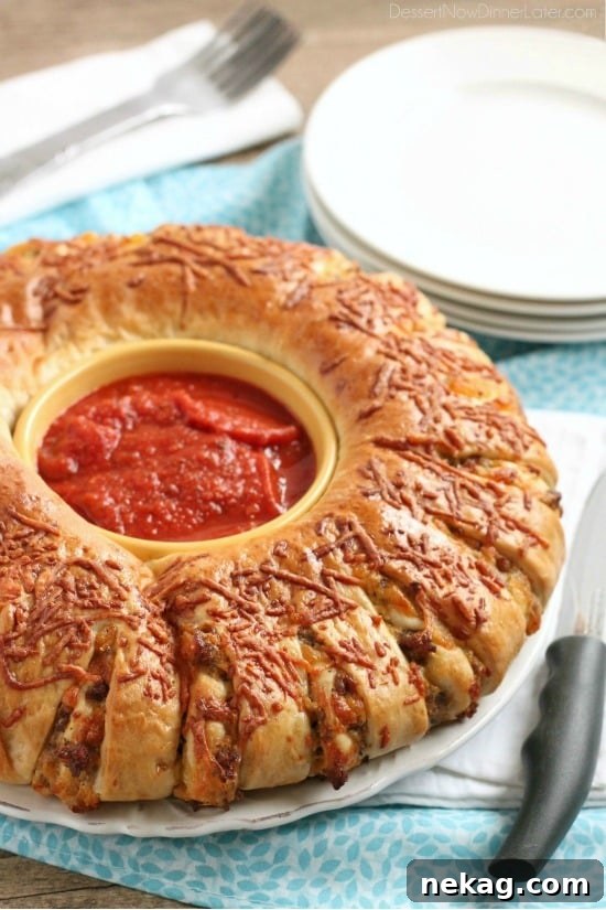 Hearty Sausage Stromboli 3 Close-up of baked Sausage Stromboli, golden-brown and ready to serve for a family dinner or football party.