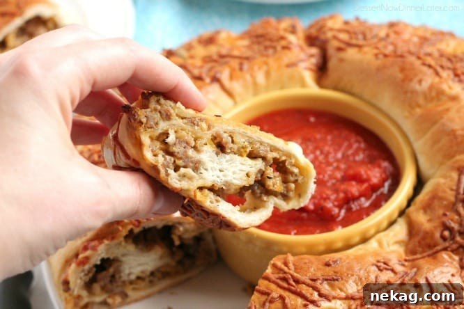 Hearty Sausage Stromboli 4 Sausage and cheese filling spread on Rhodes bread dough, ready to be rolled into a stromboli.