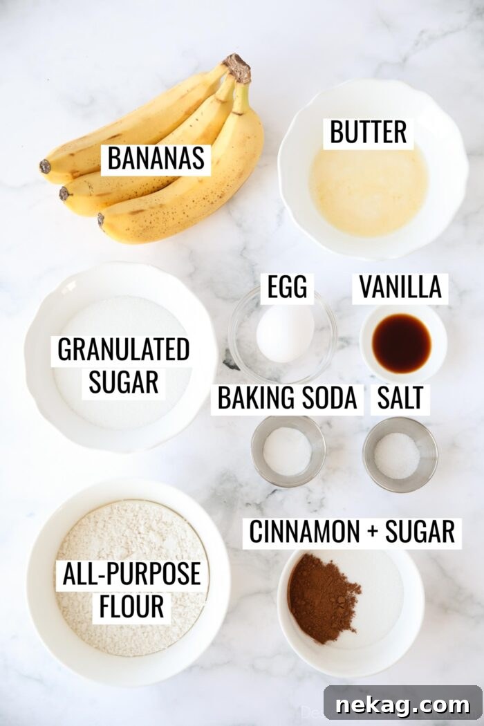 All the necessary ingredients for cinnamon swirl banana bread laid out and clearly labeled on a countertop, ready for baking.