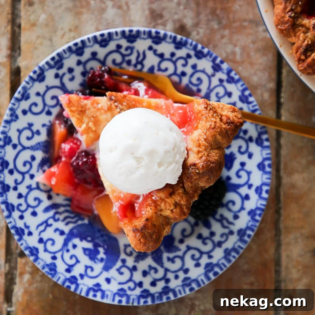 Sun-Kissed Peach Blackberry Delight 2 Golden brown Peach Blackberry Pie with a flaky crust