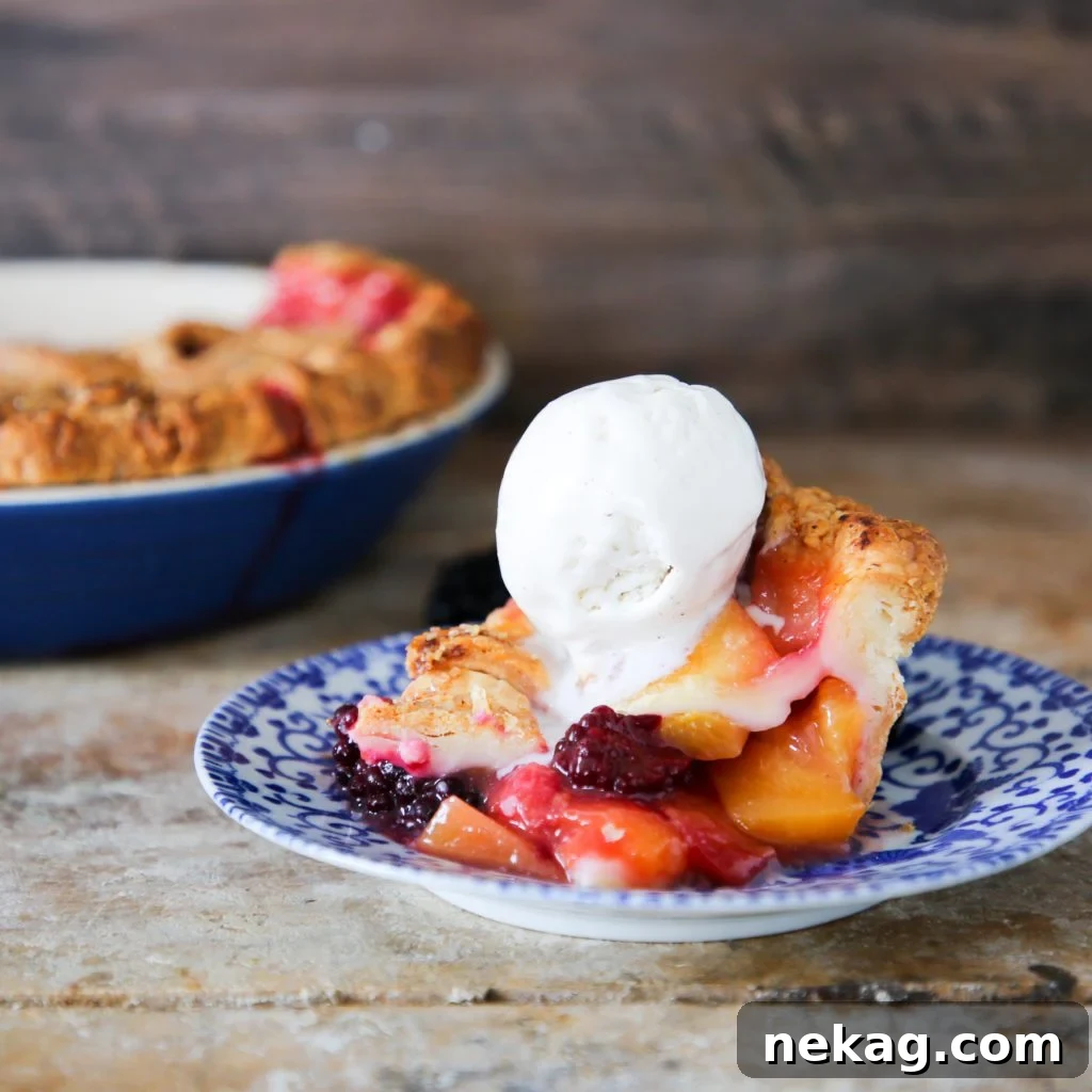 Sun-Kissed Peach Blackberry Delight 4 Slice of Peach Blackberry Pie with vanilla ice cream